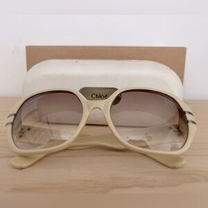 Chloe sunglasses, cream with metal detail on arms. Includes case.